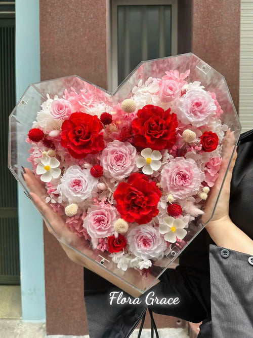Flora Grace octagon heart acrylic box filled with red and pink dried roses