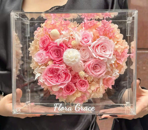Flora Grace heart dried flower box with pink roses and hydrangea in a clear acrylic case