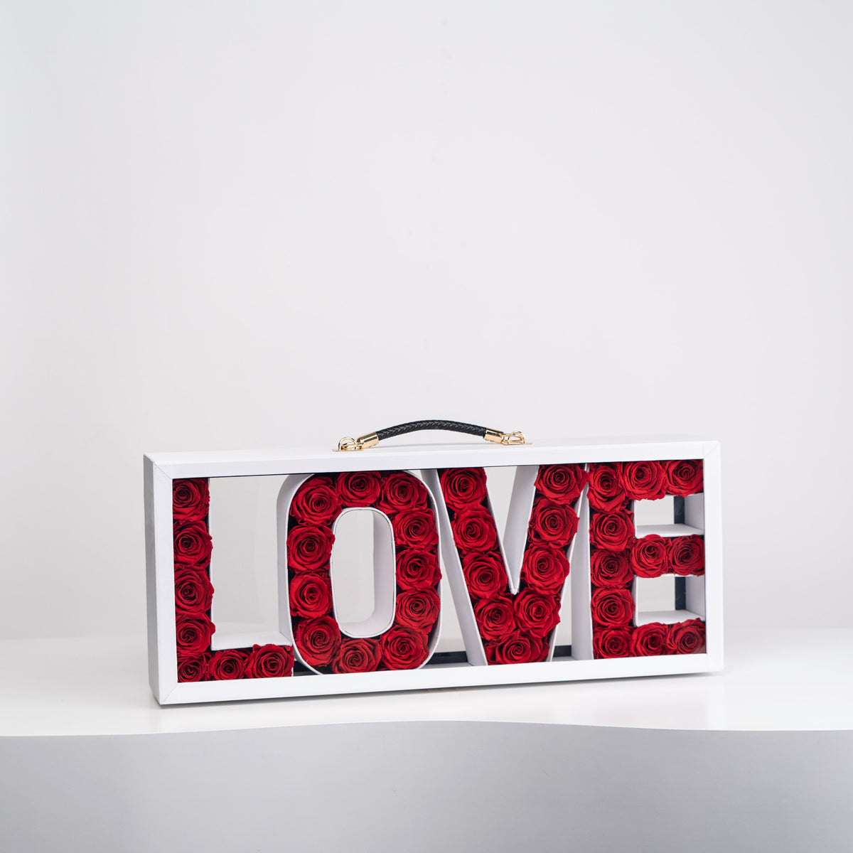 White Preserved Roses in Leather Briefcase