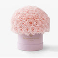 Pink Preserved Roses in Classic Pink Suede Dome Box