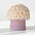 70-74 White Preserved Roses in Pink Suede Dome Box